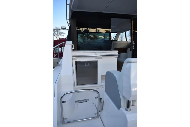  Yacht Photos Pics 2025 Regal 38 FXO yacht interior with sleek seating and modern amenities.