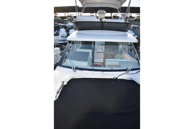  Yacht Photos Pics 2025 Regal 38 FXO yacht with sleek design and spacious interior at marina.