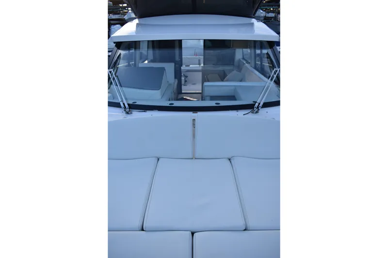  Yacht Photos Pics 2025 Regal 38 FXO boat interior with white seating and windshield view.