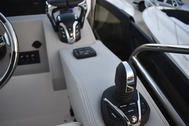  Yacht Photos Pics 2025 Regal 38 FXO boat cockpit with advanced joystick controls and steering wheel.