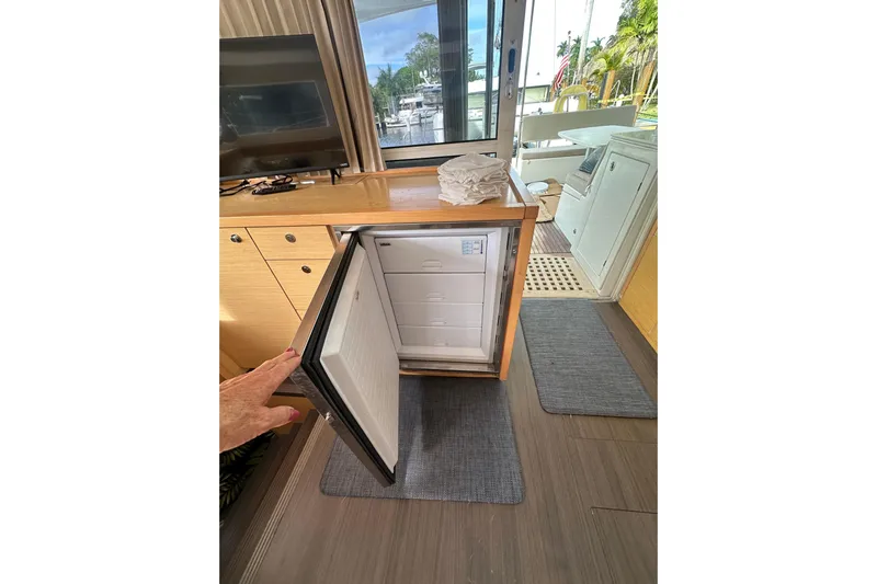 Callisto Yacht Photos Pics Interior of 2014 Lagoon 450 F yacht with open fridge and modern amenities.