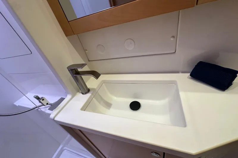 Callisto Yacht Photos Pics Modern bathroom sink on 2014 Lagoon 450 F yacht, featuring sleek faucet and countertop.