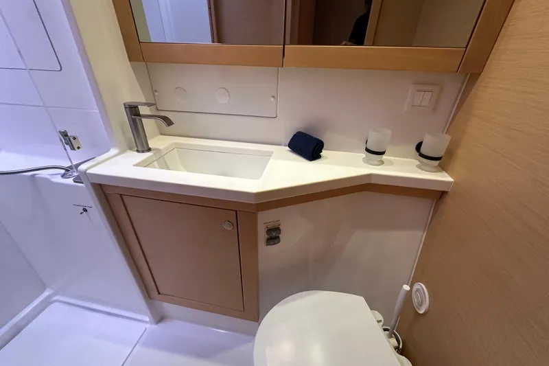 Callisto Yacht Photos Pics Modern bathroom in 2014 Lagoon 450 F yacht with sleek sink and fixtures.