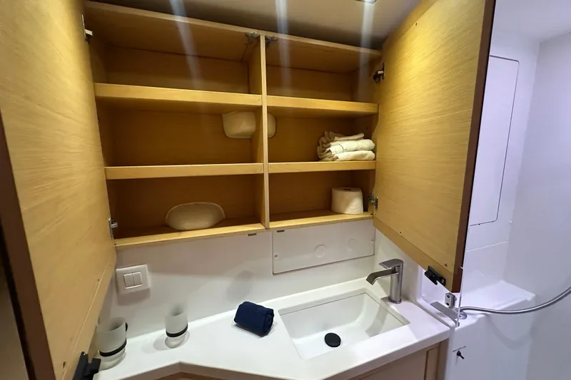 Callisto Yacht Photos Pics Bathroom cabinet and sink in 2014 Lagoon 450 F yacht interior.