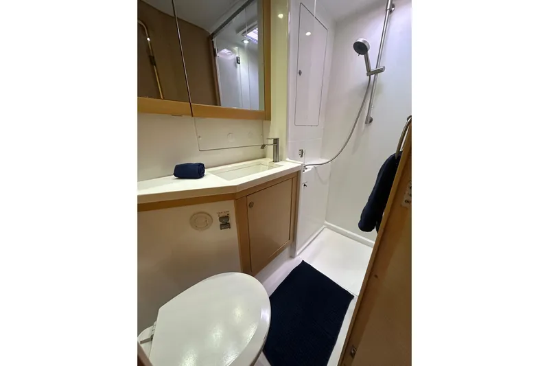 Callisto Yacht Photos Pics Bathroom interior of 2014 Lagoon 450 F yacht, featuring shower and sink.