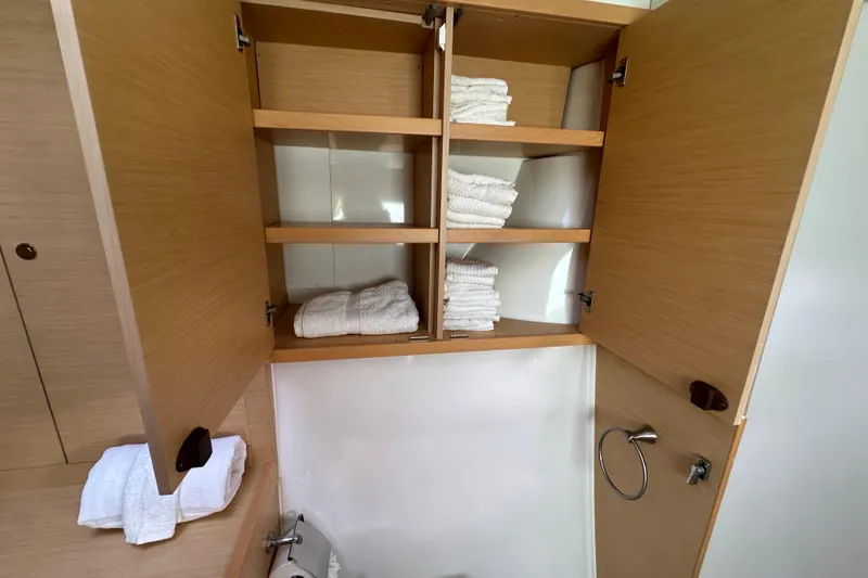 Callisto Yacht Photos Pics Cabinet with towels in 2014 Lagoon 450 F yacht bathroom.