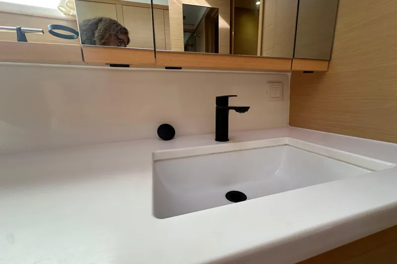 Callisto Yacht Photos Pics Modern bathroom sink with black faucet in 2014 Lagoon 450 F yacht.