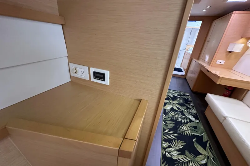 Callisto Yacht Photos Pics Interior of 2014 Lagoon 450 F yacht with modern wood finish and tropical rug.