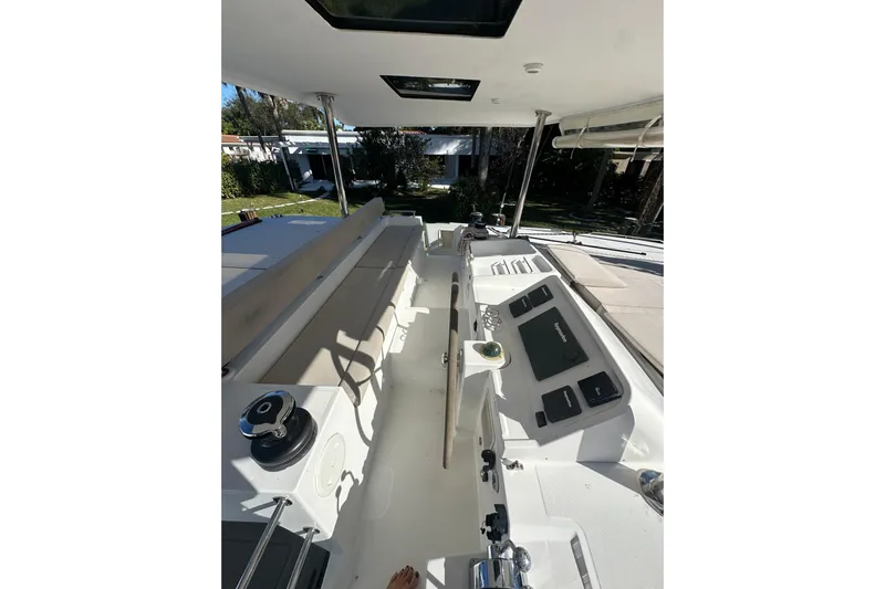 Callisto Yacht Photos Pics Interior view of 2014 Lagoon 450 F catamaran, featuring helm and seating area.