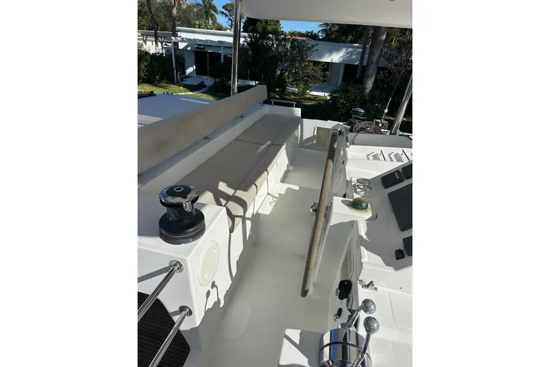 Callisto Yacht Photos Pics 2014 Lagoon 450 F yacht deck with steering wheel and seating area.