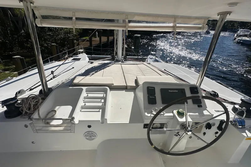Callisto Yacht Photos Pics Helm of 2014 Lagoon 450 F catamaran with steering wheel and navigation equipment.