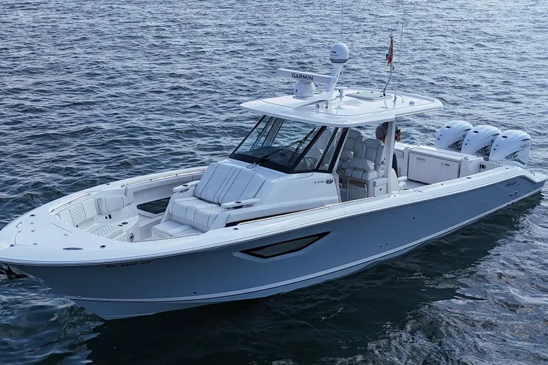 Oorah Yacht Photos Pics 2022 Pursuit S 378 Sport boat on open water, featuring sleek design and triple engines.