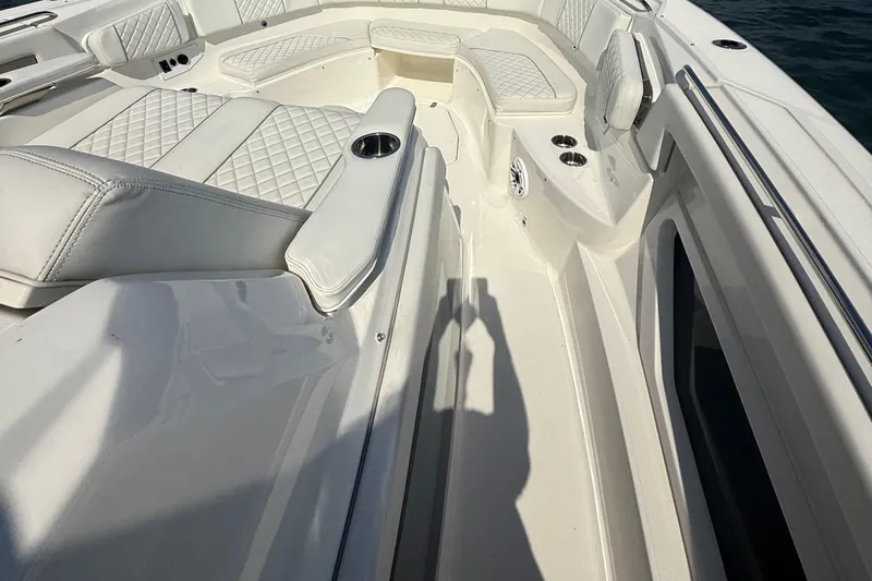 Oorah Yacht Photos Pics Luxurious seating on 2022 Pursuit S 378 Sport boat with white quilted upholstery.