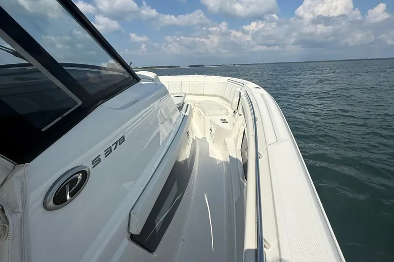 Oorah Yacht Photos Pics 2022 Pursuit S 378 Sport boat on open water under a cloudy sky.