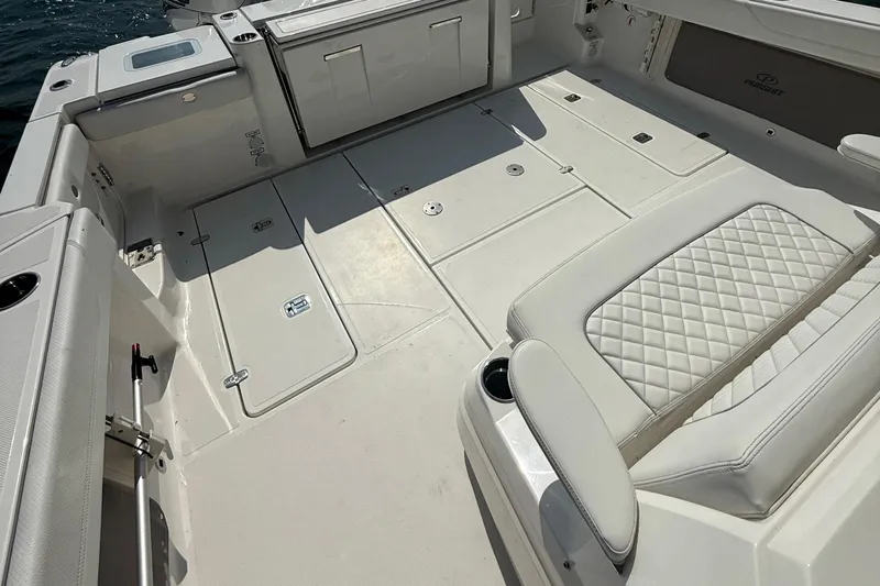 Oorah Yacht Photos Pics 2022 Pursuit S 378 Sport boat interior with cushioned seating and storage compartments.
