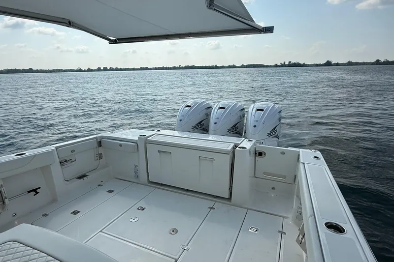 Oorah Yacht Photos Pics 2022 Pursuit S 378 Sport boat with triple outboard engines on open water.
