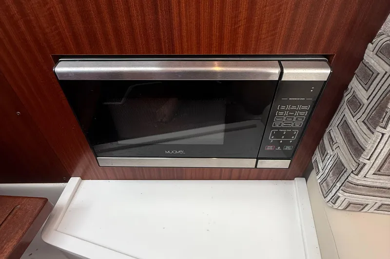 Oorah Yacht Photos Pics Built-in microwave in 2022 Pursuit S 378 Sport boat interior.