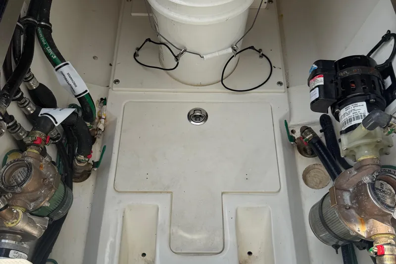 Oorah Yacht Photos Pics Engine compartment of 2022 Pursuit S 378 Sport boat with visible mechanical components.