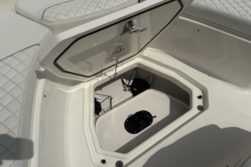 Oorah Yacht Photos Pics Open storage compartment on 2022 Pursuit S 378 Sport boat with quilted seating.