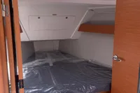 2023 Dufour 32 yacht cabin with wooden interior and skylight.