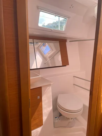  Yacht Photos Pics 2023 Dufour 32 yacht bathroom with modern fixtures and natural light.