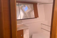 2023 Dufour 32 yacht bathroom with modern fixtures and natural light.