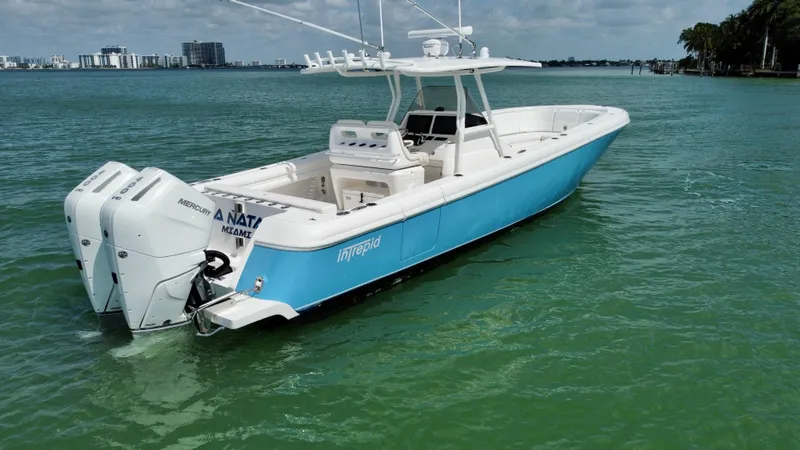 La Nata 3 Yacht Photos Pics 2015 Intrepid 375 Center Console boat on calm water, featuring twin outboard engines.