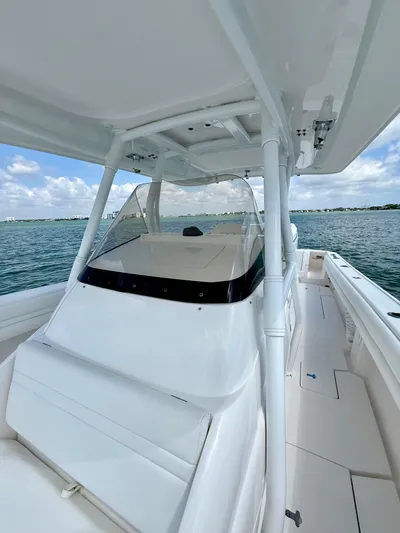 La Nata 3 Yacht Photos Pics 2015 Intrepid 375 Center Console boat on calm water under a clear sky.