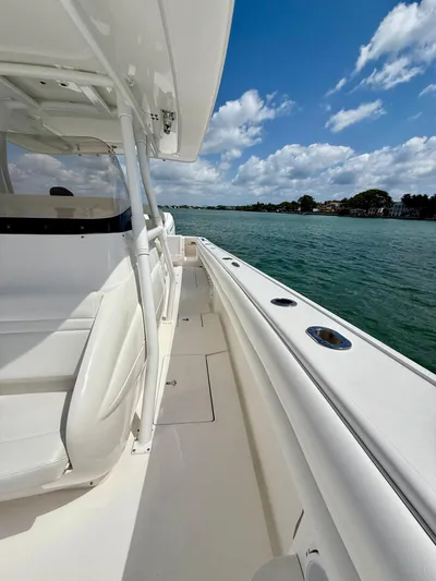 La Nata 3 Yacht Photos Pics 2015 Intrepid 375 Center Console boat on calm water under a blue sky.