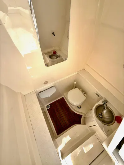 La Nata 3 Yacht Photos Pics 2015 Intrepid 375 Center Console boat interior with toilet and sink.