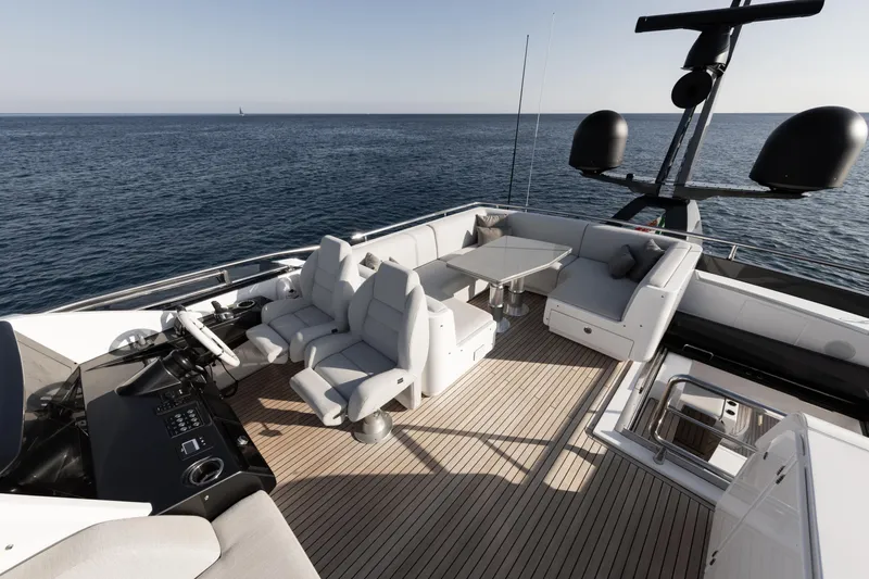 Never Give Up Yacht Photos Pics Luxurious 2021 Azimut S8 yacht deck with modern seating and ocean view.
