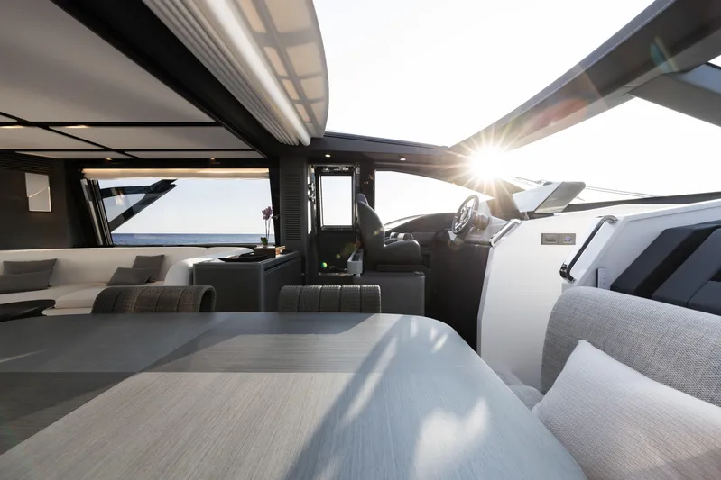 Never Give Up Yacht Photos Pics Luxurious interior of 2021 Azimut S8 yacht with modern design and sunlight streaming in.