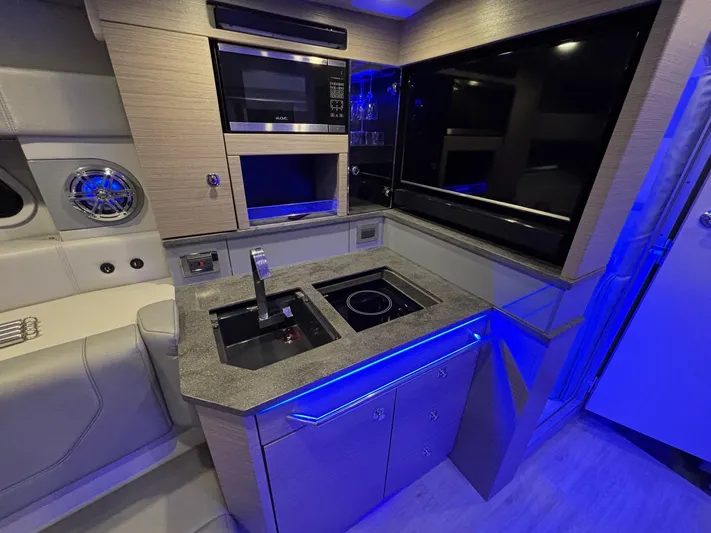  Yacht Photos Pics Modern kitchen area in 2018 Formula 430 Super Sport Crossover yacht with sleek appliances.
