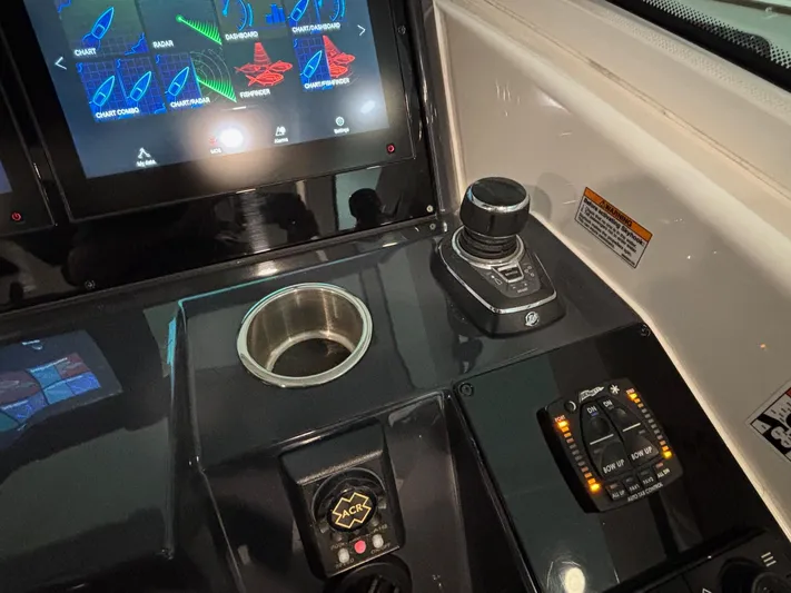  Yacht Photos Pics Control panel of a 2018 Formula 430 Super Sport Crossover boat with touchscreen and joystick.