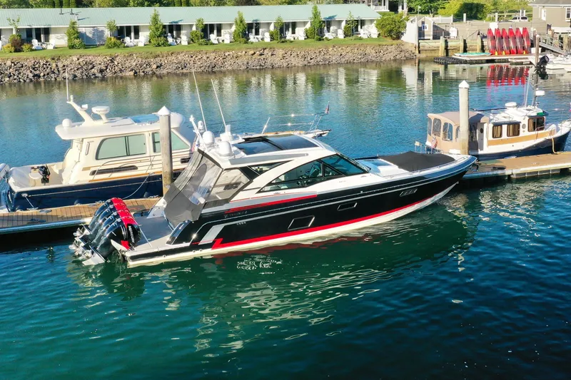  Yacht Photos Pics 2018 Formula 430 Super Sport Crossover yacht docked in a serene marina.