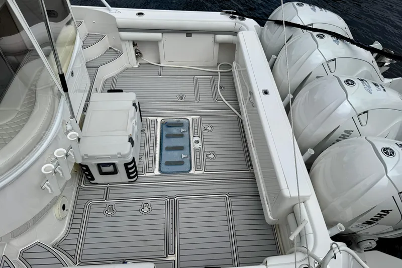 Tekeze Yacht Photos Pics 2019 Intrepid 475 Sport Yacht deck with Yamaha outboard engines and storage compartments.