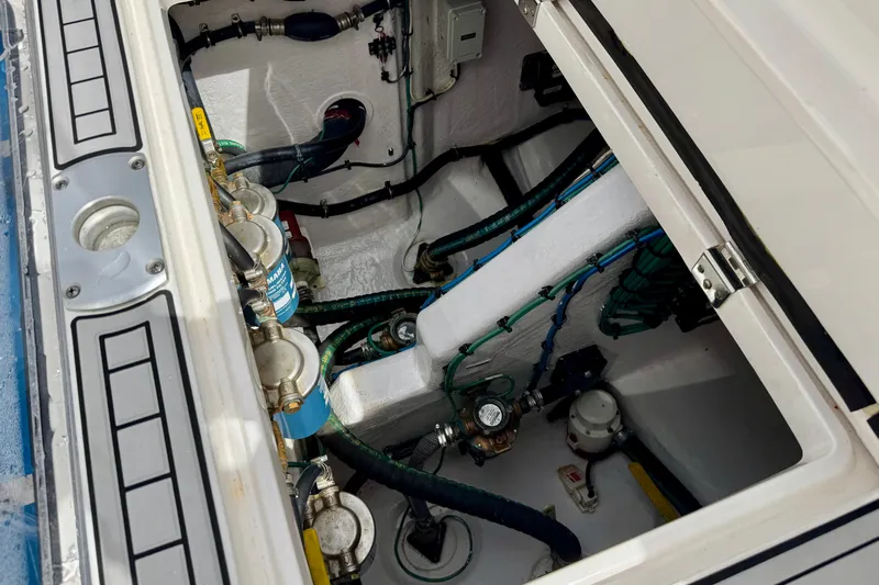 Tekeze Yacht Photos Pics Engine compartment of a 2019 Intrepid 475 Sport Yacht, showcasing mechanical components and wiring.