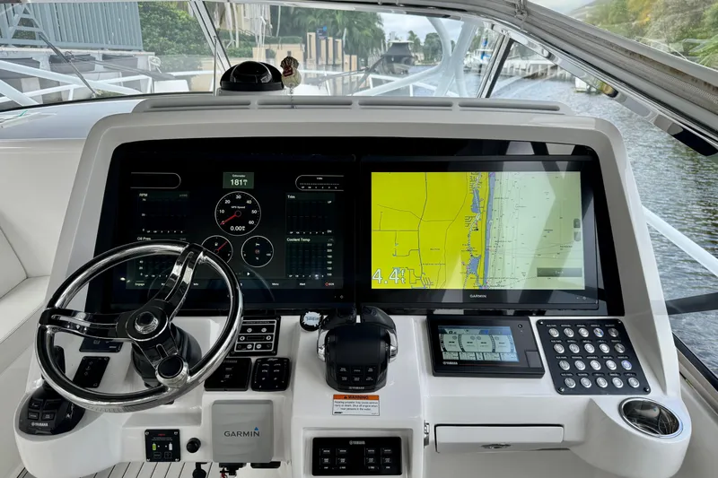 Tekeze Yacht Photos Pics Helm of 2019 Intrepid 475 Sport Yacht with Garmin navigation system and steering wheel.