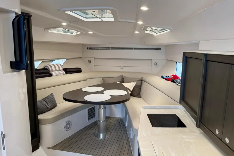 Tekeze Yacht Photos Pics Luxurious interior of 2019 Intrepid 475 Sport Yacht with modern seating and dining area.