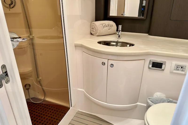 Tekeze Yacht Photos Pics Luxurious bathroom in 2019 Intrepid 475 Sport Yacht with modern fixtures and shower.