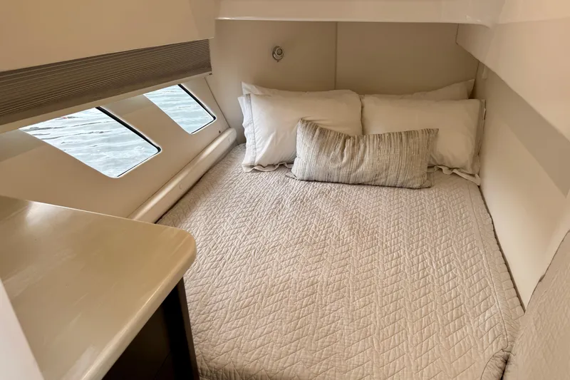 Tekeze Yacht Photos Pics Cozy cabin interior of 2019 Intrepid 475 Sport Yacht with comfortable bedding.