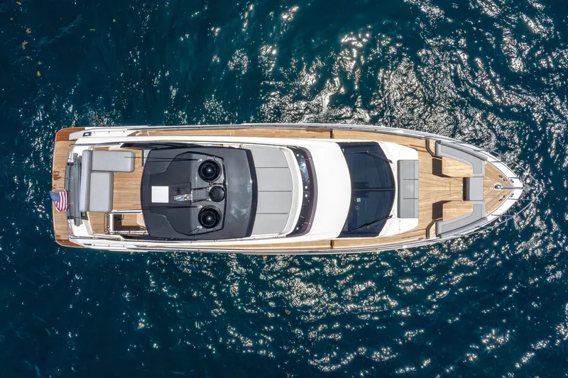  Yacht Photos Pics Aerial view of 2022 Ferretti Yachts 670 on sparkling blue water.