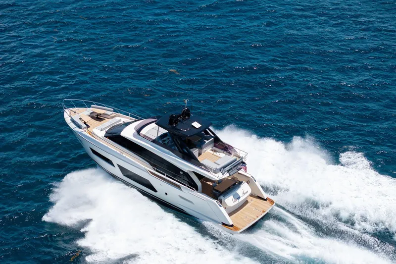  Yacht Photos Pics Luxurious 2022 Ferretti Yachts 670 cruising on open blue sea.