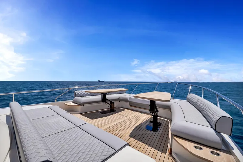  Yacht Photos Pics Luxurious 2022 Ferretti Yachts 670 deck with elegant seating and ocean view.