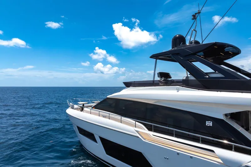  Yacht Photos Pics Luxury Ferretti Yachts 670, 2022 model, cruising on open sea under clear blue sky.