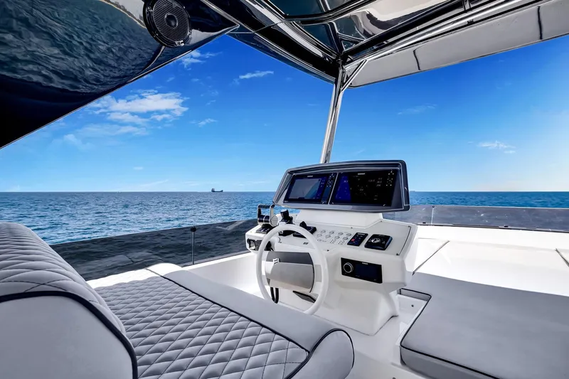  Yacht Photos Pics Luxurious 2022 Ferretti Yachts 670 helm with ocean view and modern navigation systems.