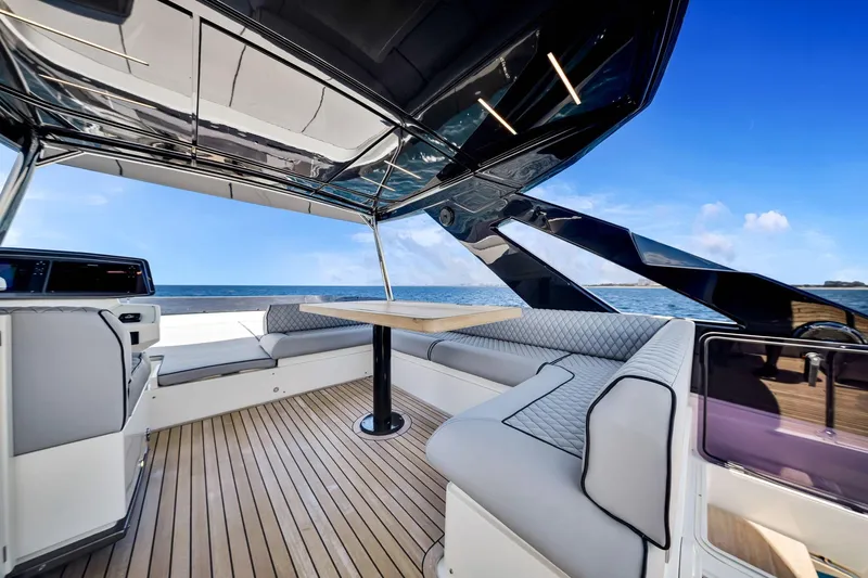  Yacht Photos Pics Luxurious 2022 Ferretti Yachts 670 with elegant seating and ocean view.