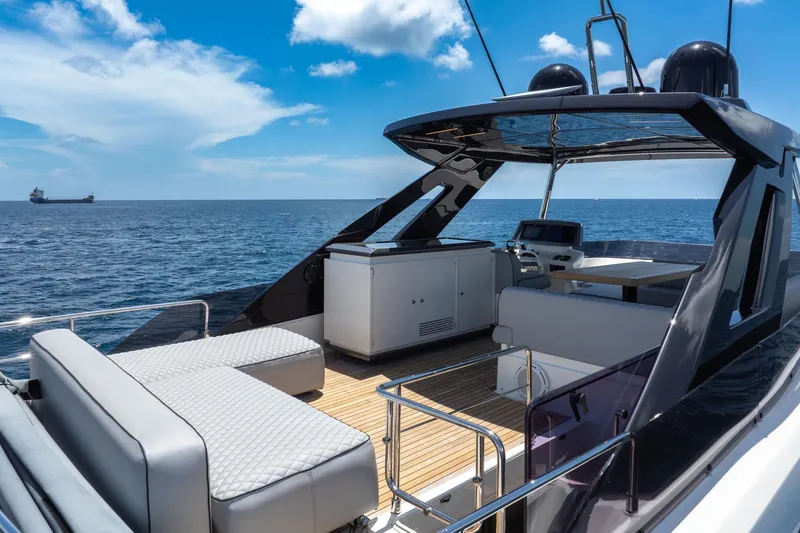  Yacht Photos Pics Luxurious 2022 Ferretti Yachts 670 on open sea, featuring elegant deck and seating area.