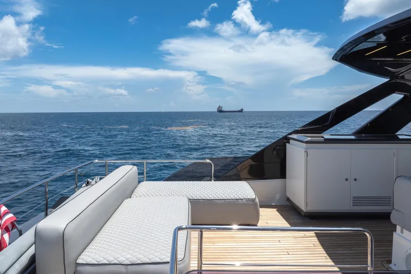 Yacht Photos Pics Luxurious 2022 Ferretti Yachts 670 deck with ocean view and modern seating.