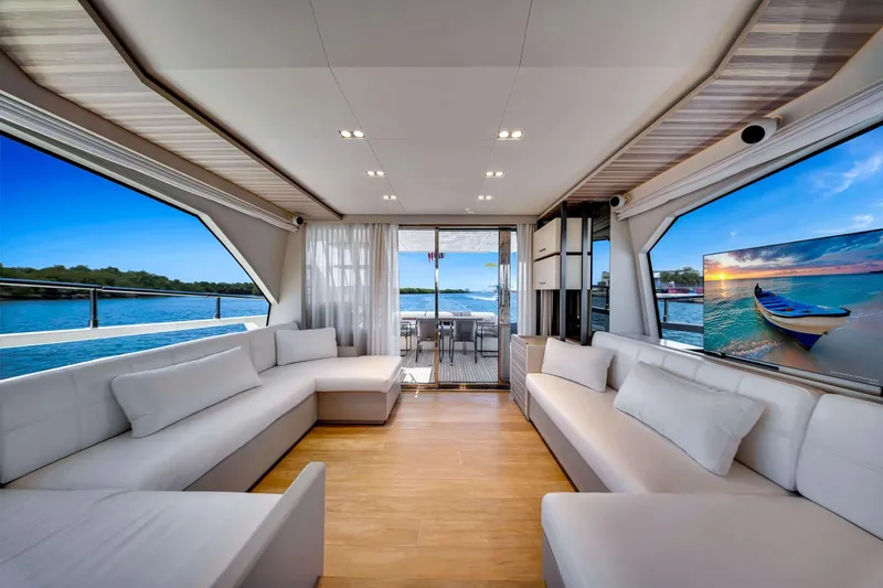  Yacht Photos Pics Luxurious interior of 2022 Ferretti Yachts 670 with elegant seating and scenic views.